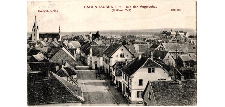 Man sieht eine alte Postkarte. Sie zeigt die 
